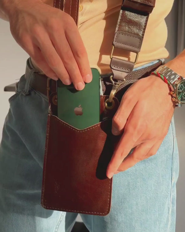 Video showing the handmade leather crossbody phone bag for men from all angles, including front, back, sides, and details.
